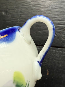 Imperfect vintage haunted cup and saucer