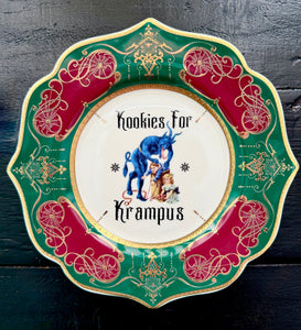 2025 Limited Edition Kookies for Krampus salad plate featuring Krampus overseeing Victorian children, framed in emerald, crimson, and gold.