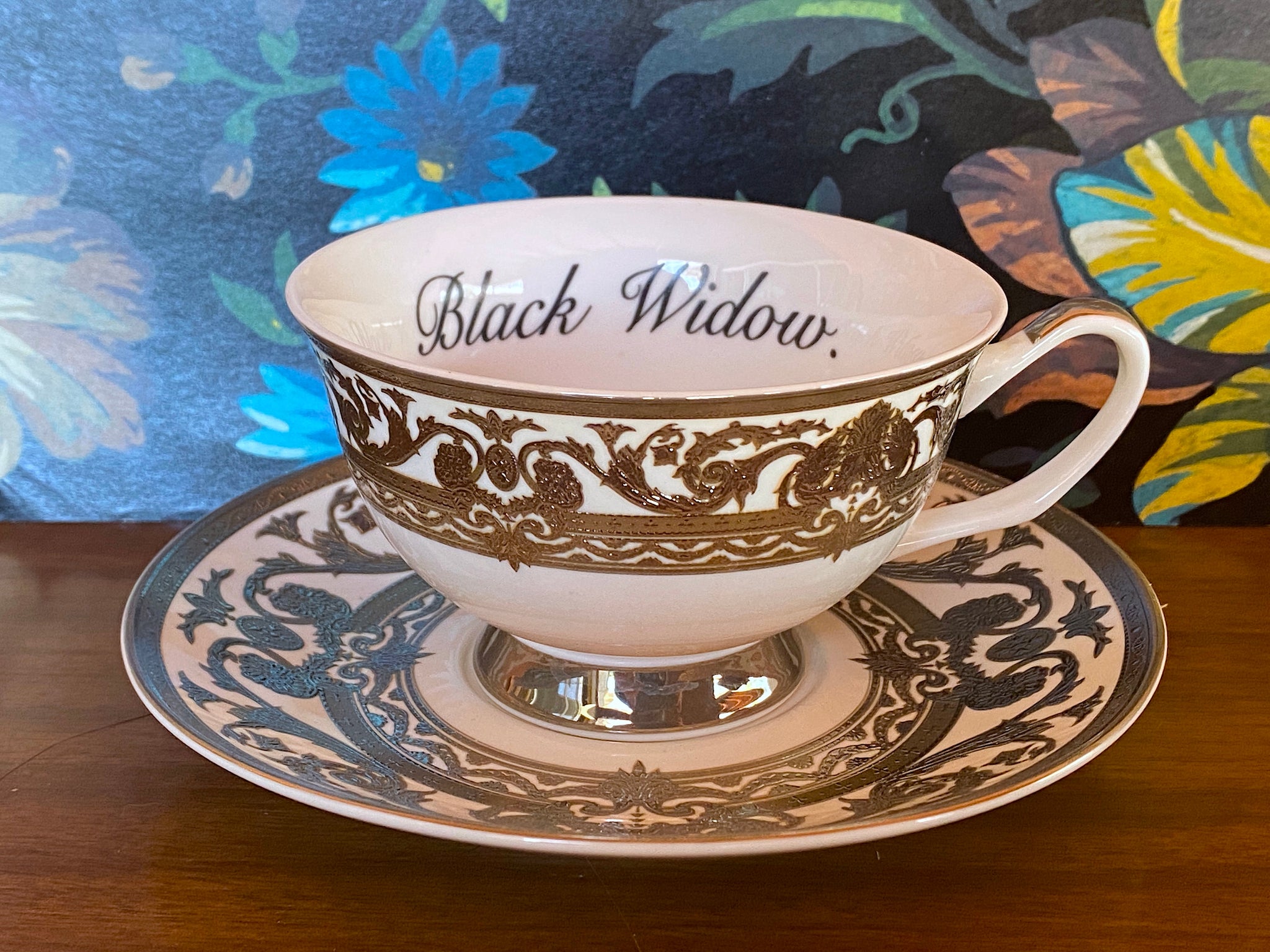 Silver Black Widow cup and saucer